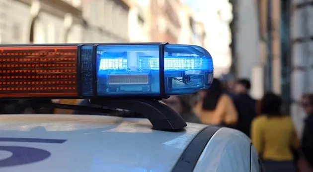patrol-police-car-with-blue-light-of-sirens-in-the-city