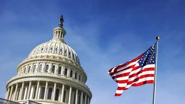 american-flag-waving-with-the-capitol-hill