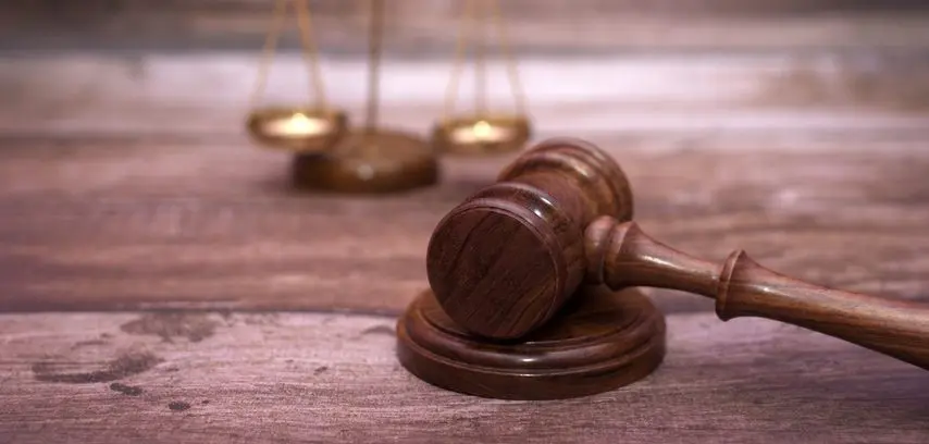 justice-scales-and-wooden-gavel