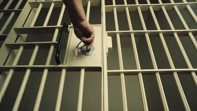 key-in-jail-cell-door