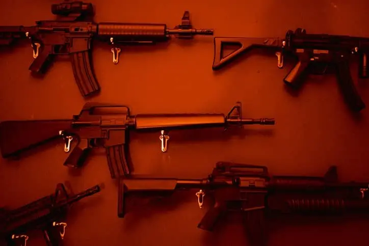 numerous-assault-rifles-hanging-on-wall