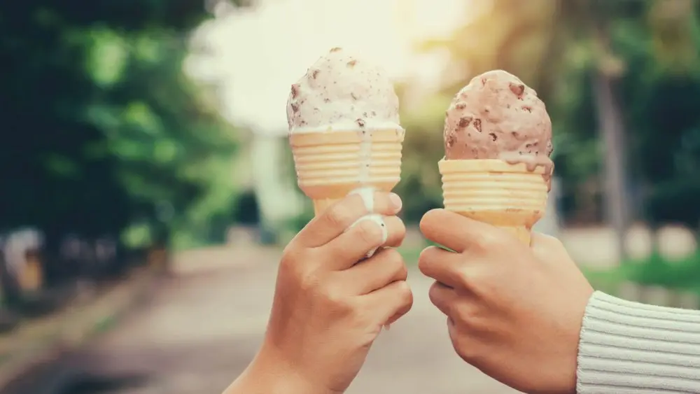 childrenshandsholdingicecreamconeonsummerlightnature