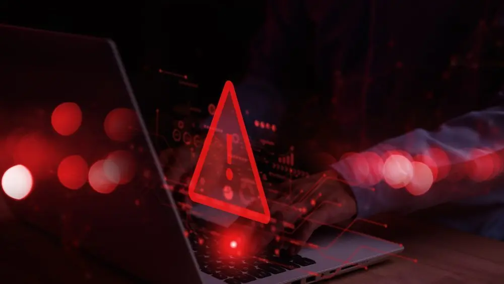 systemhackedwarningalertonnotebooklaptop-cyberattackon