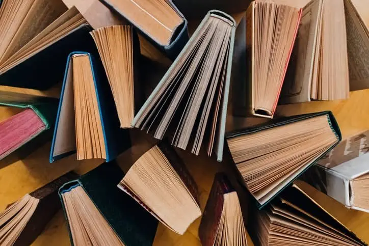 group-of-books-on-wooden-planks-background-top-view