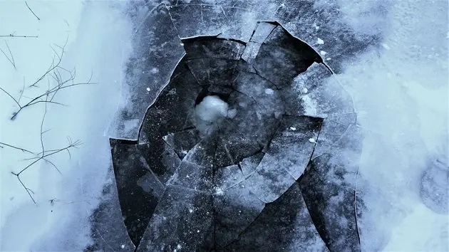 high-angle-view-of-broken-frozen-lake-during-winter