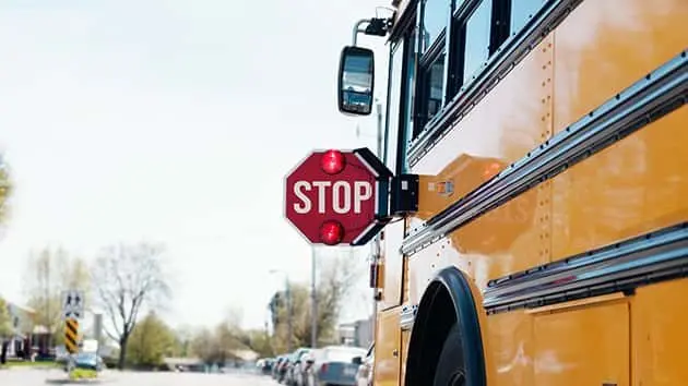 yellow-school-bus-with-stop-sign