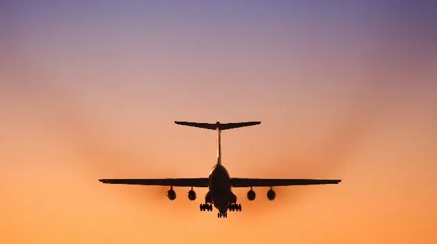 jet-airplane-landing-in-beautiful-sunset-sky-2