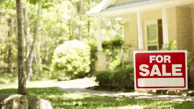 home-for-sale-with-real-estate-sign