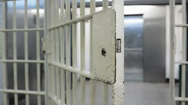 open-door-to-prison-cell