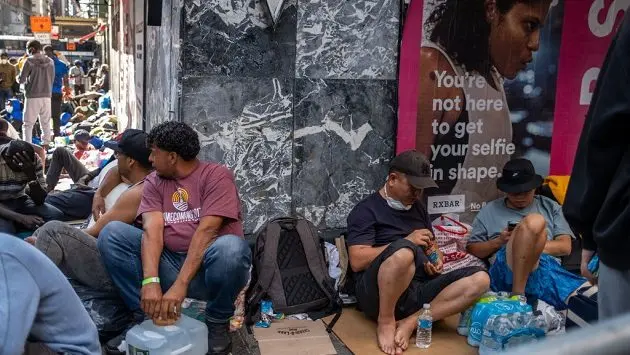 migrants-wait-outside-midtown-hotel-in-hopes-of-being-temporarily-housed