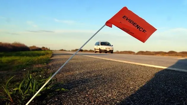 an-evidence-marker-is-seen-along-ocean-parkway-near-gilgo-beach-new-york-in-2011