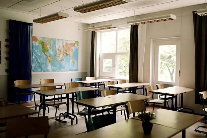 desks-and-chairs-arranged-in-classroom-at-high-school-2