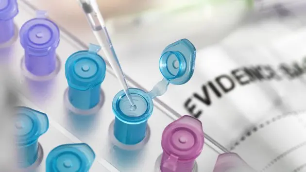 pipetting-dna-sample-collected-from-crime-scene-into-vial-for-forensic-testing-in-laboratory