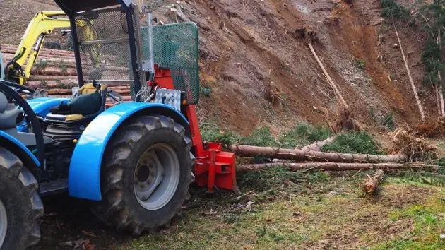 tractor-clearing-fallen-trees-after-storm