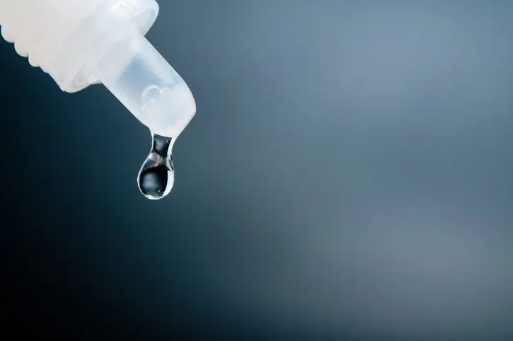 close-up-of-liquid-dropping-from-pipette
