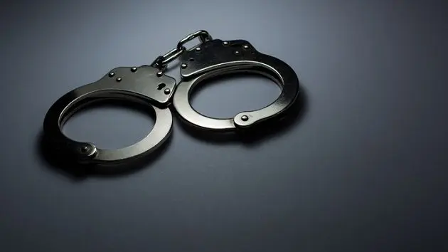 close-up-of-handcuffs-over-gray-background-3