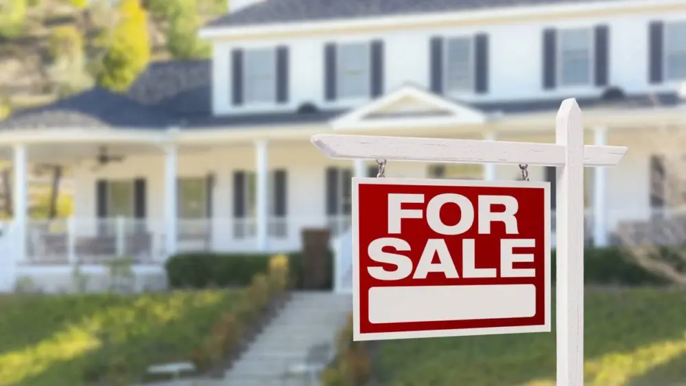 home-for-sale-sign-in-front-of-new-house