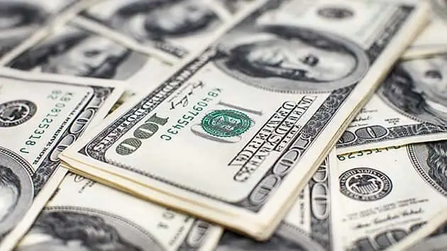 heap-of-one-hundred-dollar-bills-on-money-background-shallow