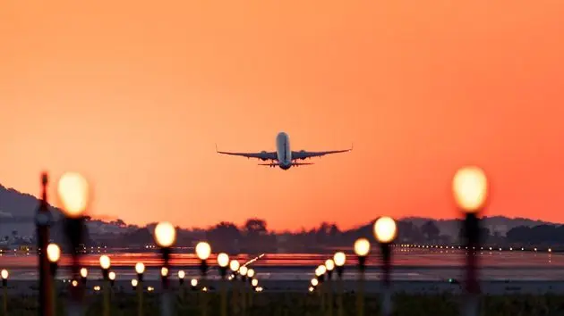 airplane-taking-off-at-sunrise-travel-and-tourism-2