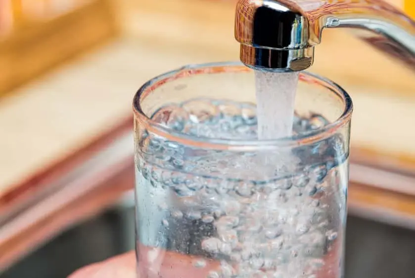 filling-up-a-glass-with-drinking-water-from-kitchen-tap