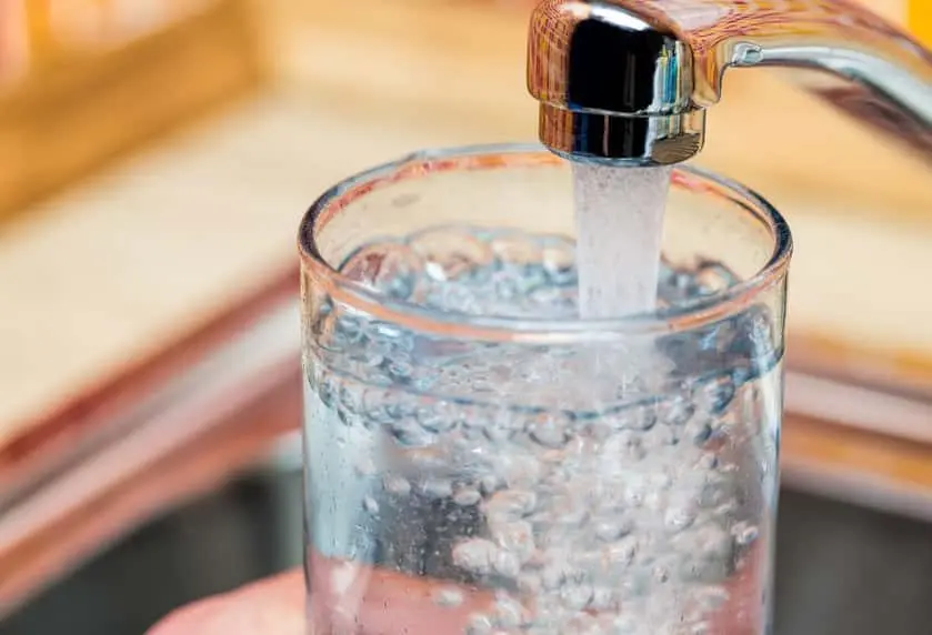 filling-up-a-glass-with-drinking-water-from-kitchen-tap