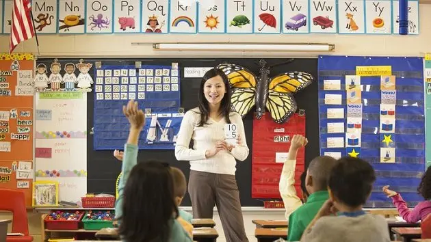 asian-teacher-teaching-math-to-students-in-classroom