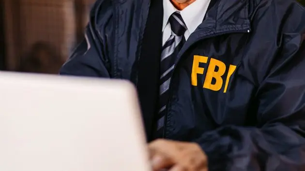 fbi-detective-using-laptop-in-his-office-2