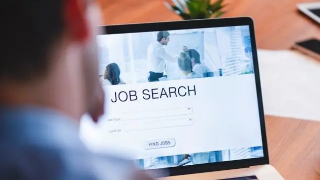 businessman-looking-at-job-search-website-on-a-laptop-computer
