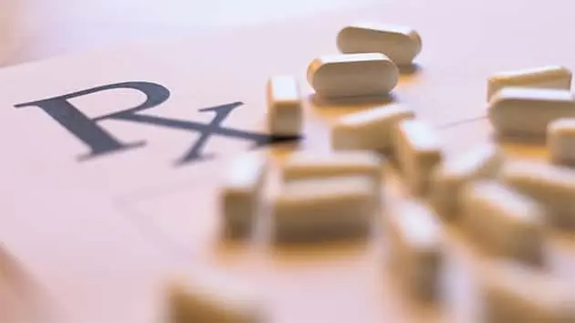 prescription-pills-concept-with-blank-rx-form