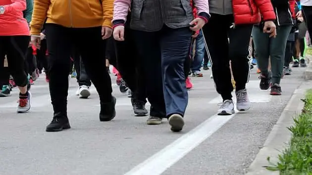 people-walk-down-the-street-during-a-demonstration-in-the-city