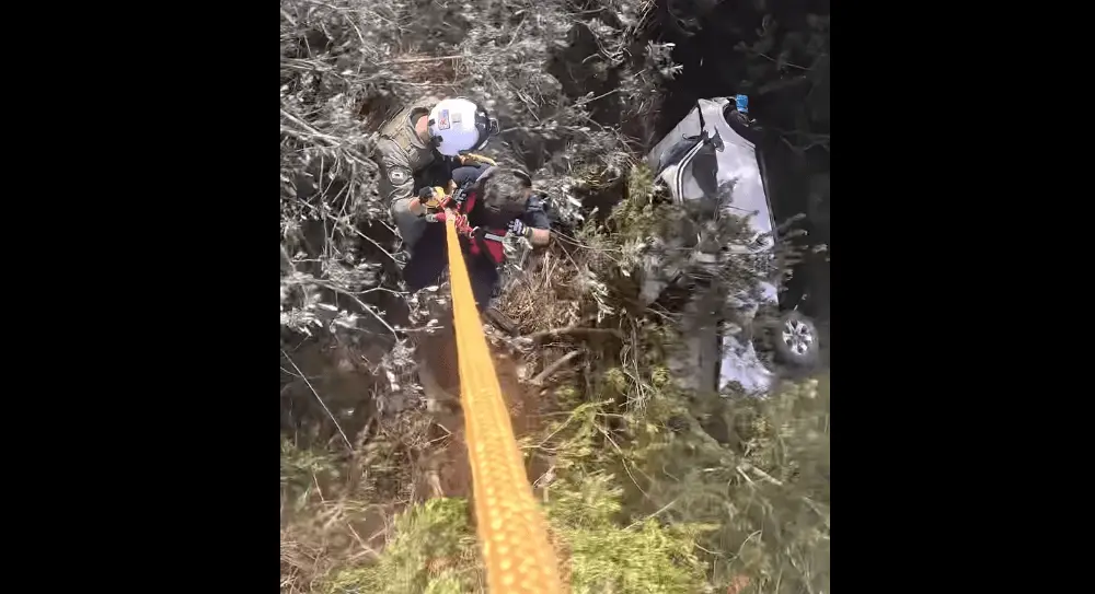 rescuers-from-henry-1-inspecting-crashed-car-near-jenner-5-19-24-sonoma-sheriff