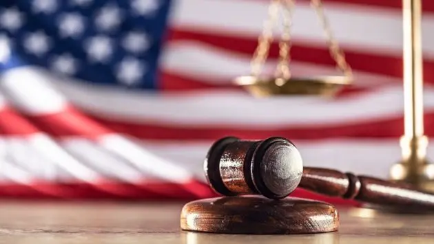 gavel-and-scales-with-a-us-flag-in-the-background-as-symbols-of-a-jurisdiction