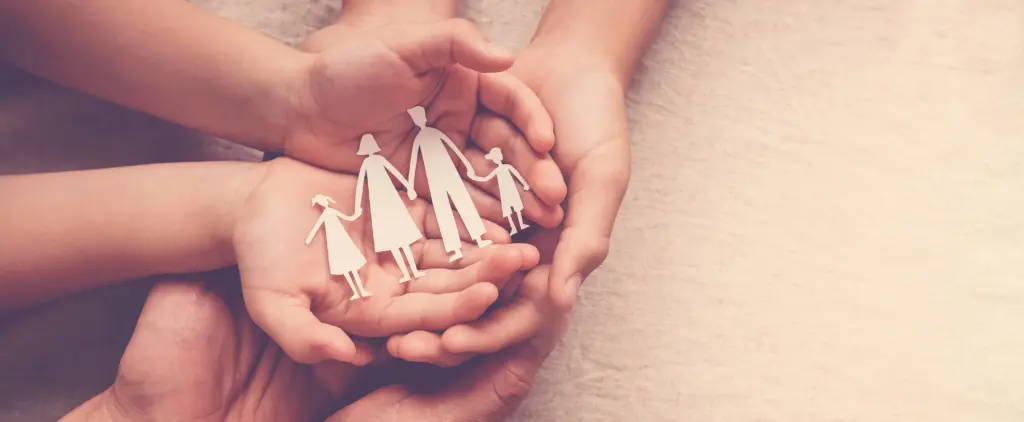 handsholdingpaperfamilycutoutfamilyhomefostercarehomeless
