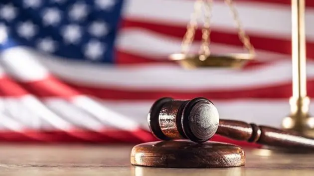 gavel-and-scales-with-a-us-flag-in-the-background-as-symbols-of-a-jurisdiction-2