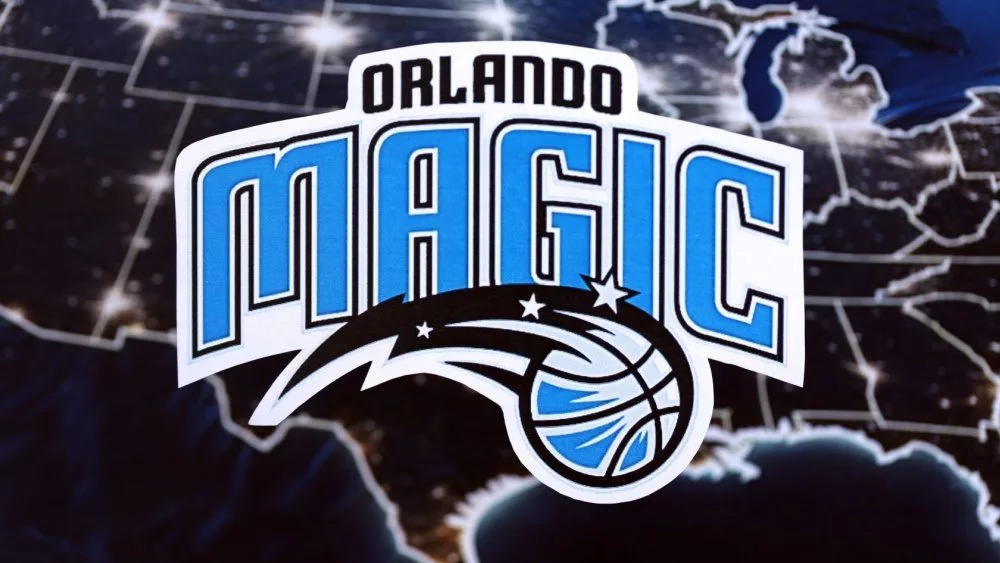 Orlando Magic basketball team badge lies on United States map background banne