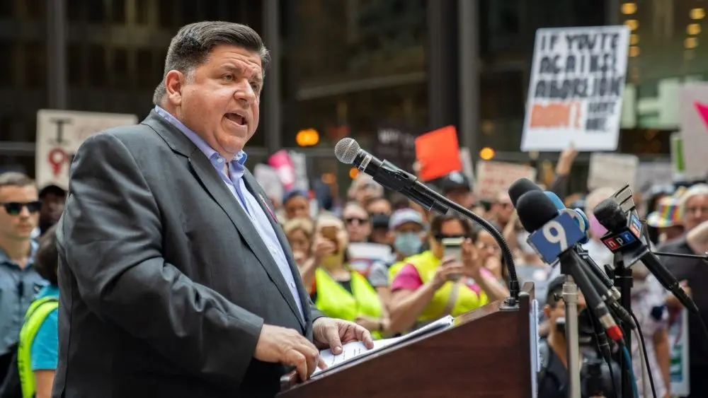 Protests in downtown Chicago after overturning of Roe v. Wade^ Governor of Illinois^ J. B. Pritzker^ talking to protester in support Chicago^ Illinois - June 24 2022