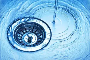 close-up-of-kitchen-sink-with-water-running-away