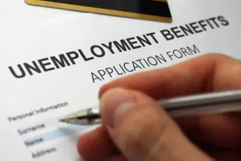 someone-completing-an-unemployment-benefits-form