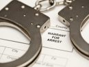 handcuffs-on-a-warrant-for-arrest-4