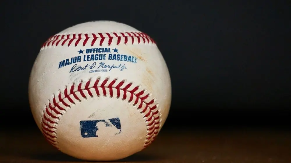Major League Baseball (MLB) Baseball on black background