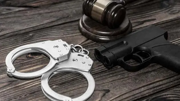 istock_gunhandcuffs_082319