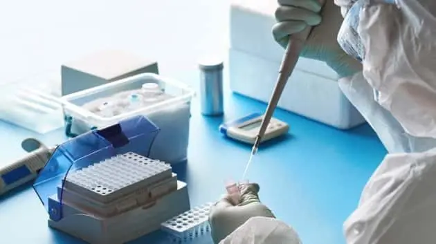 sars-cov-2-pcr-diagnostics-kit-epidemiologist-in-protective-suit-mask-and-glasses-works-with-patient-swabs-to-detect-specific-region-of-2019-ncov-virus-causing-covid-19-viral-pneumonia