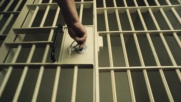 key-in-jail-cell-door-7