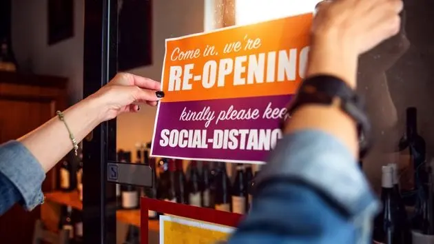 open-sign-in-a-small-business-shop-after-covid-19-pandemic