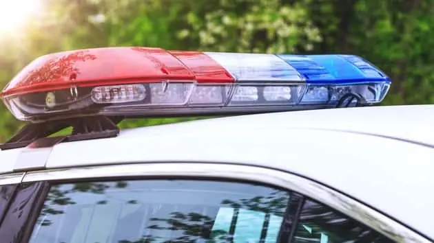 police-patrol-car-with-sirens-off-during-a-traffic-control-blue-and-red-flashing-sirens-of-police-car-during-the-roadblock-in-the-city-12