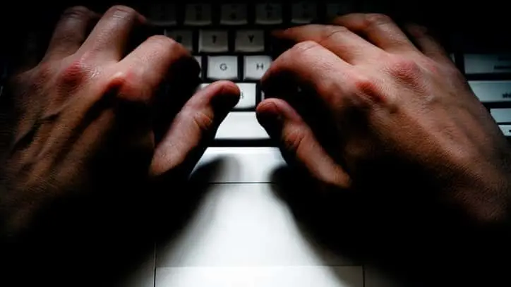 a-close-up-of-male-hands-on-a-laptop-keyboard