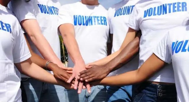 multi-ethnic-volunteer-group-hands-together