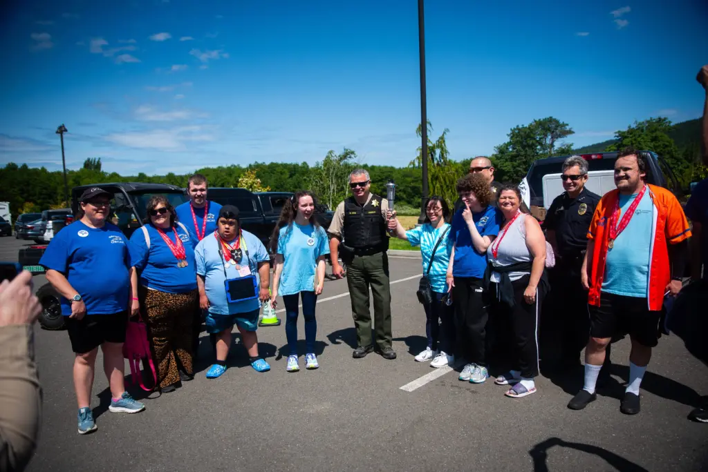 sheriff-king-with-special-olympians-and-torch