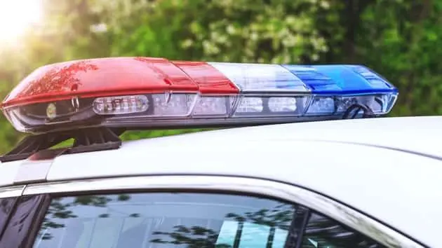 police-patrol-car-with-sirens-off-during-a-traffic-control-blue-and-red-flashing-sirens-of-police-car-during-the-roadblock-in-the-city-15