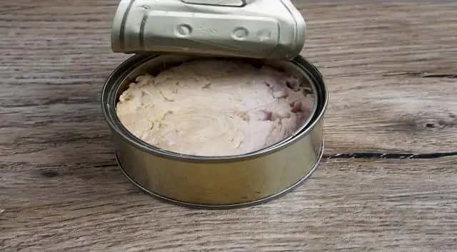 tuna-canned-on-wood-background